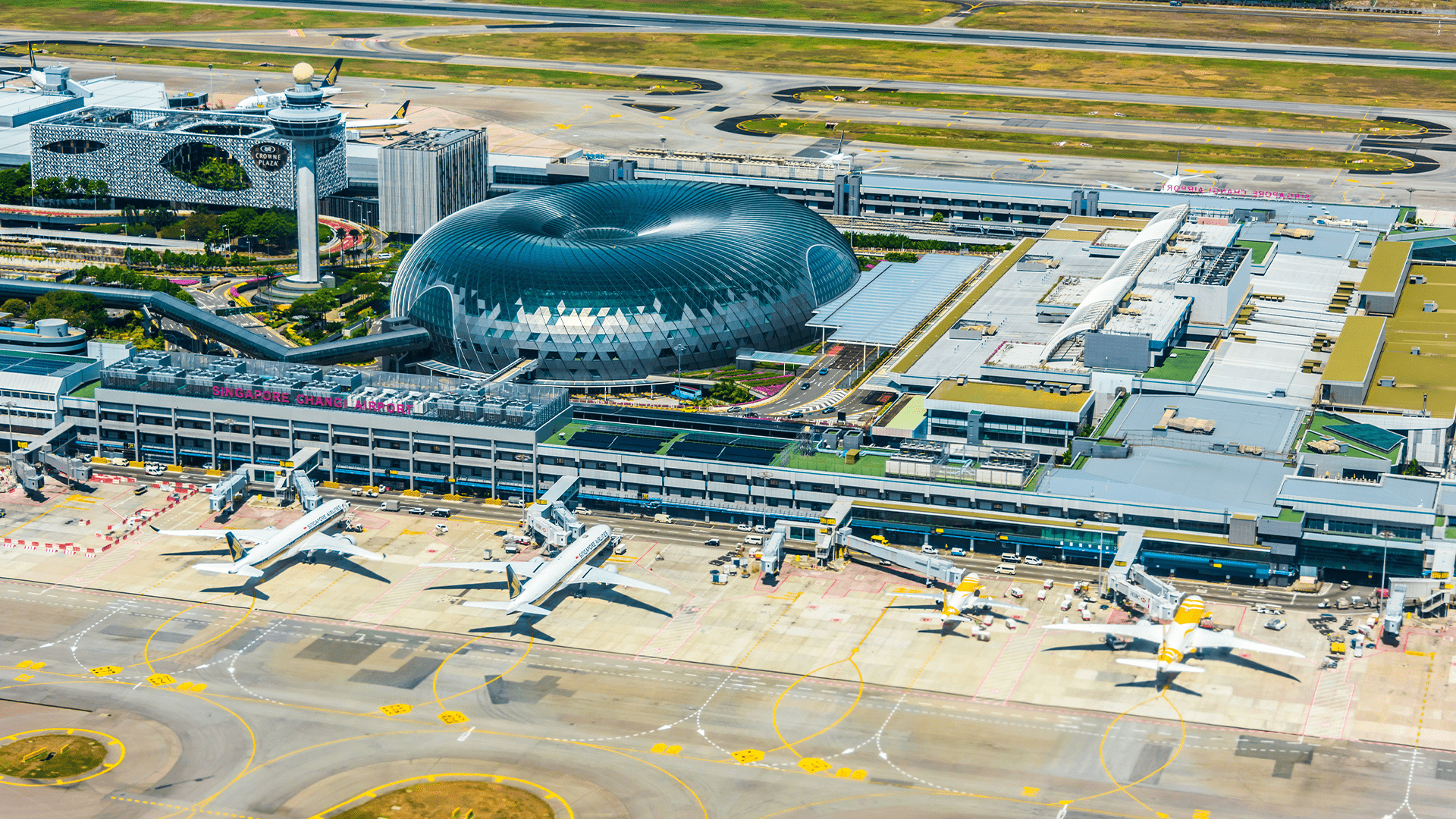 Aerial view Changi Airport Singapore with airplanes on apron 